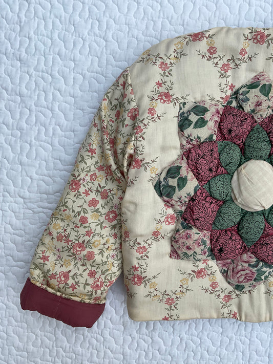 ‘Edie’ reversible puffer jacket with quilted flower